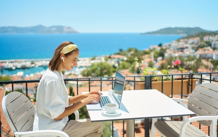 Woman working outside on a laptop