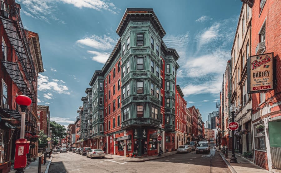 Historic East End Boston Massachusetts United States brick buildings bakery restaurants and shops car street intersection landmark little Italy Italian American city town downtown area red orange USA