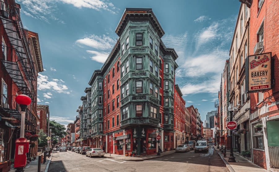Historic East End Boston Massachusetts United States brick buildings bakery restaurants and shops car street intersection landmark little Italy Italian American city town downtown area red orange USA
