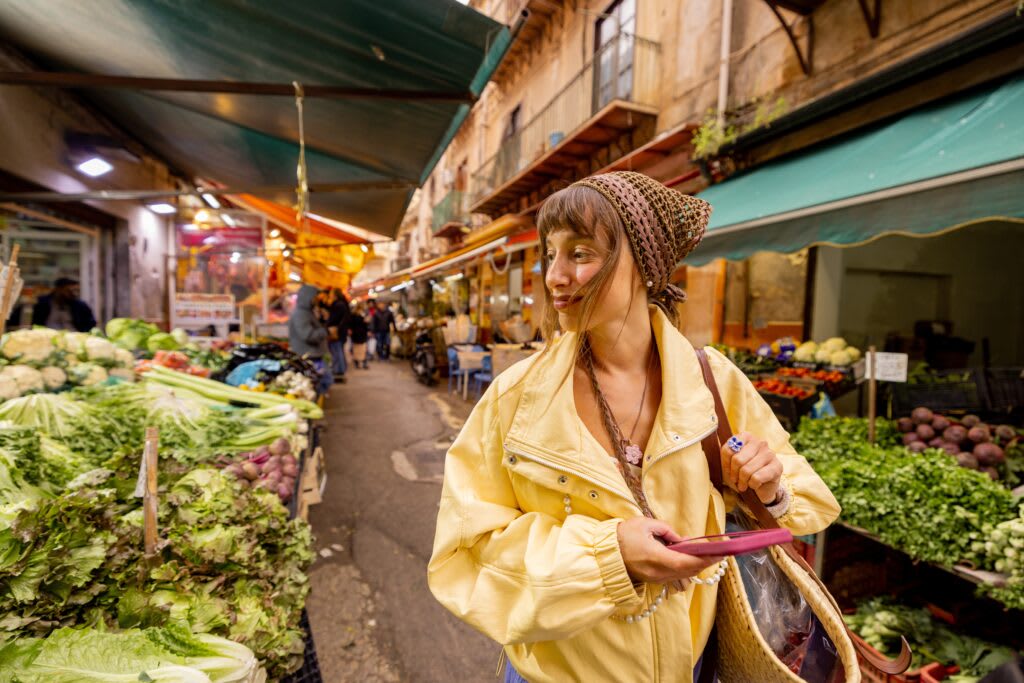 Woman browsing veg at a market