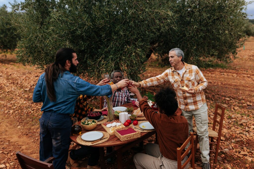 Friends eating in olive grove